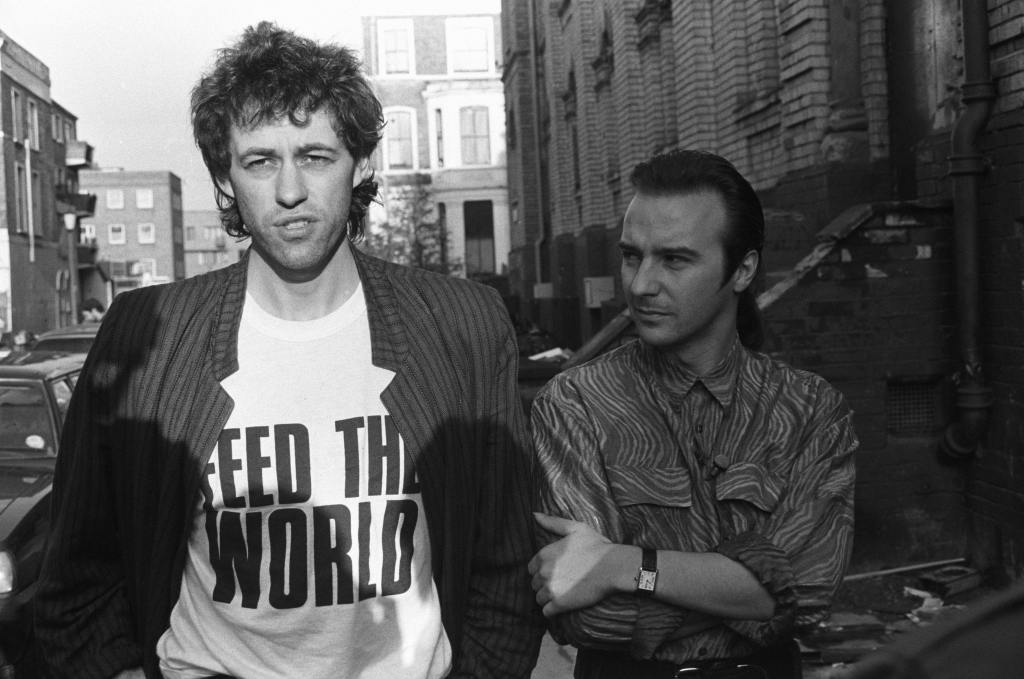 Bob Geldof and Midge Ure pictured outside SARM Studios in Notting Hill, London, during the recording of the Band Aid single 'Do They Know It's Christmas?', part of the Feed The World campaign, raising money for famine-stricken Ethiopia, on November 25, 1984.