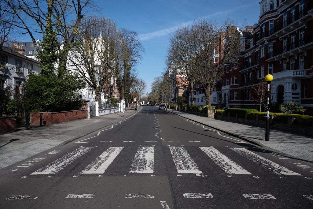 GALLERY: Abbey Road Crosswalk Gets Repainted During Coronavirus Lockdown