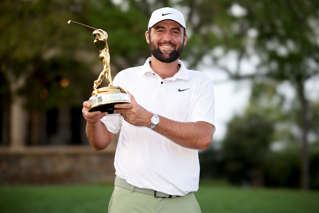 Scottie Scheffler of the United States poses with the trophy after winning THE PLAYERS Championship at TPC Sawgrass on March 17, 2024 in Ponte Vedra Beach, Florida.