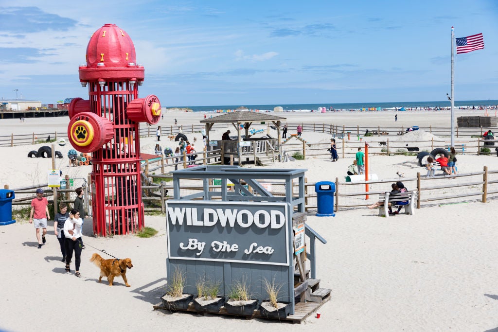 WILDWOOD, NEW JERSEY - MAY 27: People spend time on the beach during the Memorial Day weekend on May 28, 2023 in Wildwood, New Jersey. Memorial Day weekend kicks off the start of the beach season on the East Coast.