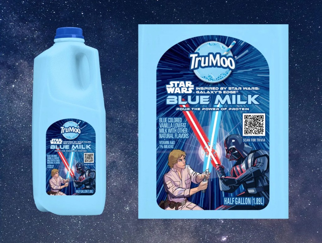 Half gallon jug of TruMoo's new blue milk with Star Wars characters Luke Skywalker and Darth Vader in a lightsaber battle on the lable. 