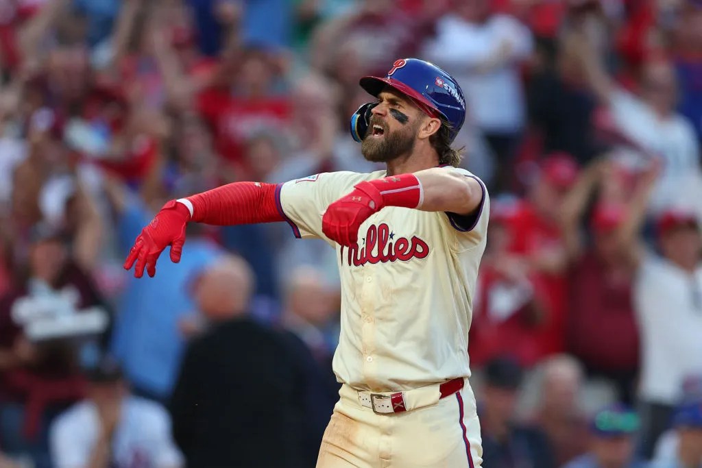 PHILADELPHIA, PENNSYLVANIA - OCTOBER 06: Bryce Harper #3 of the Philadelphia Phillies celebrates after hitting a two-run home run during the sixth inning against the New York Mets in Game Two of the Division Series at Citizens Bank Park on October 06, 2024 in Philadelphia, Pennsylvania.